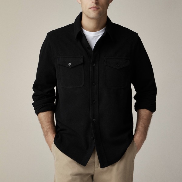 a man wearing a long sleeve button front soft knit shirt