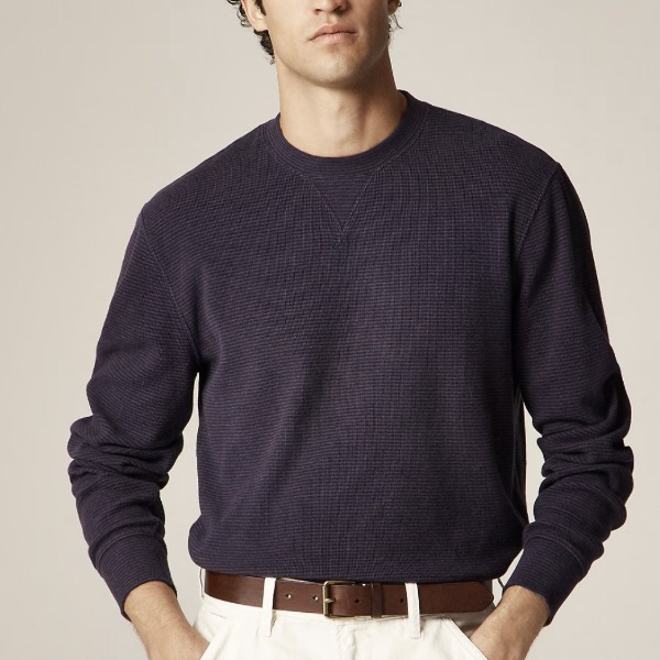 man wearing a Jacquard rib-knit crewneck in stripe with pants
