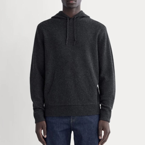 man wearing a felted Merino hoodie over casual pants