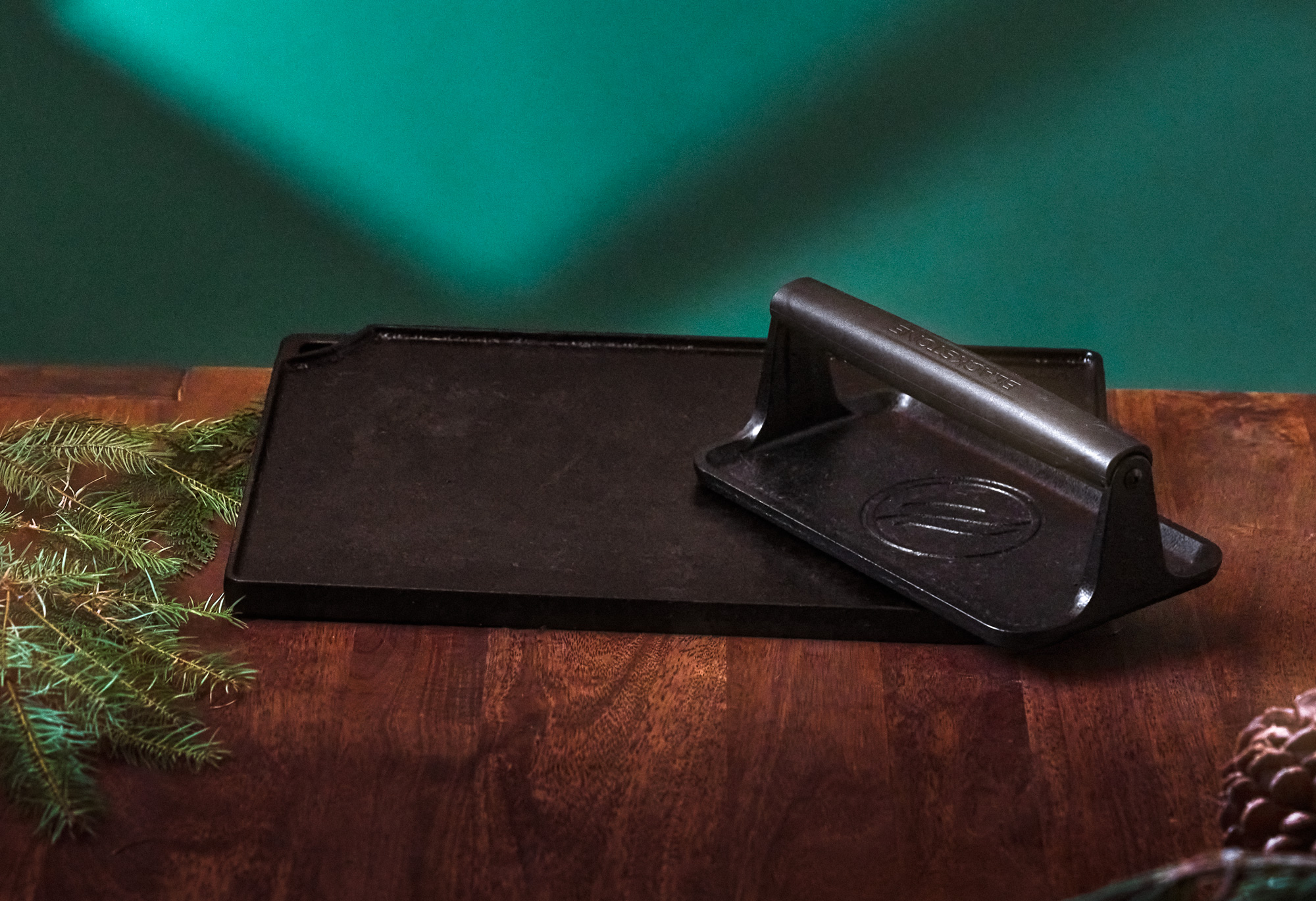 cast iron griddle with a griddle press