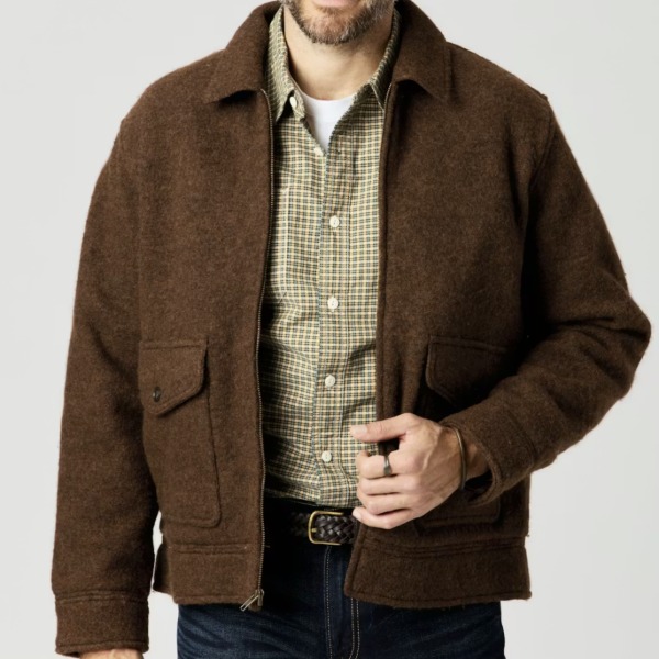 man wearing a boiled wool jacket over a button front shirt