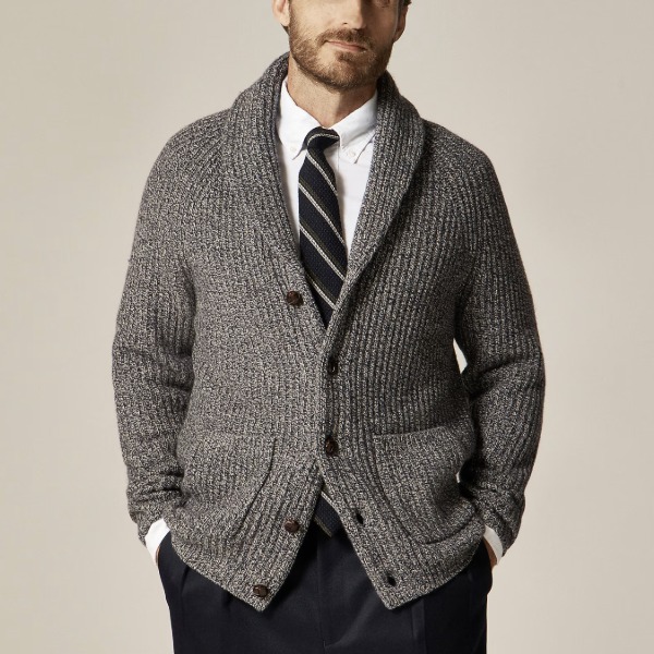 man wearing a merino wool blend shawl collar cardigan with a shirt and tie